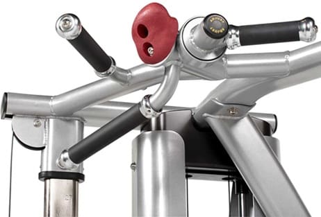 Close-up of a gym machine handle and adjustment knob.