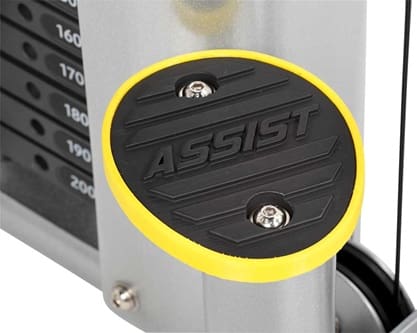 Close-up of an exercise machine part labeled 'ASSIST' with a yellow rim.