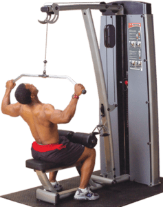 Man using lat pulldown machine at gym.