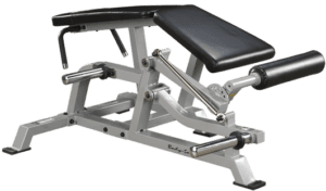 Exercise machine with adjustable padded bench.
