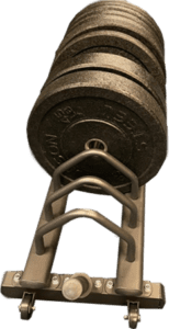 Stacked weight plates on gym equipment rack.