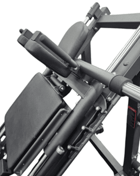 Close-up of a black gym machine with padded supports and handles.
