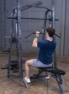 Man exercising on a cable machine.
