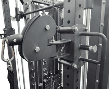 Close-up of weight plates loaded on a gym machine rack.