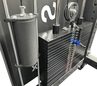 Close-up of a scientific apparatus with fluid and pressure gauges.