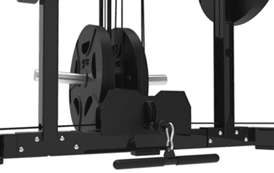 Close-up of gym equipment with weight plates and a handlebar on the floor.