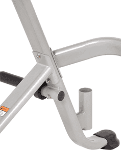 Close-up of a metallic joint on a fitness machine frame.