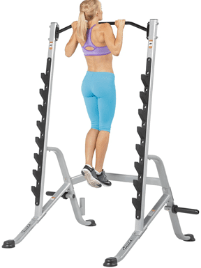A woman doing calf raises using a squat rack for support.