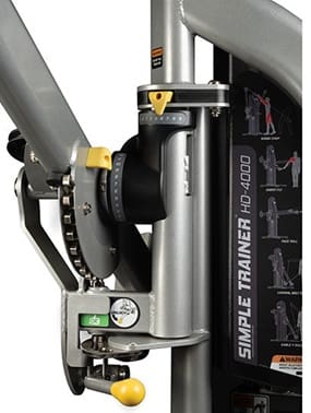 Black multi-functional gym machine with cables and pulleys.