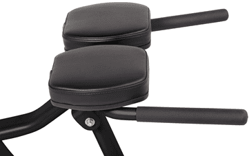 Compact glute ham developer for lower body workouts.