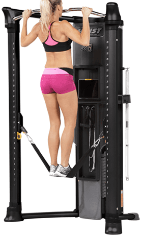 Person exercising calves on a machine, wearing pink shorts.