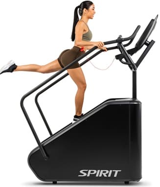 Woman exercising on a stair climber machine.