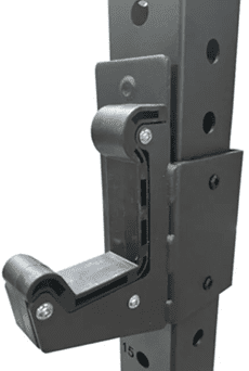 Close-up of a black mechanical hinge with bolts and moving parts.