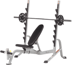 Adjustable incline weight bench with barbell and weight plates.