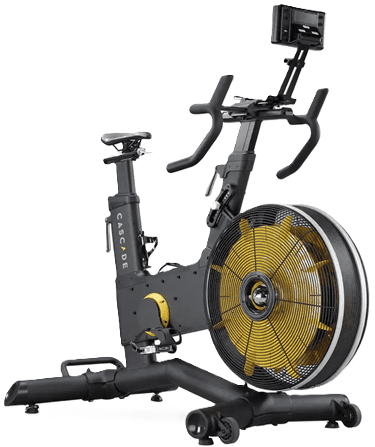 A modern stationary exercise bike with a yellow flywheel.