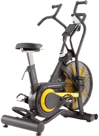 Indoor stationary exercise bike with digital display and yellow accents.