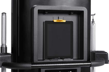 An electronic device inside a black compartment with a yellow clip.