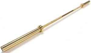 Gold Olympic weightlifting barbell on white background.