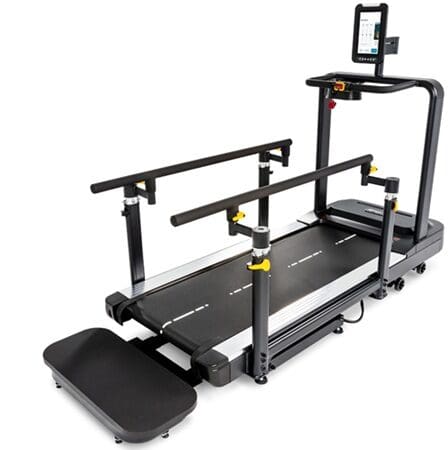 Adjustable treadmill with support handlebars and display.